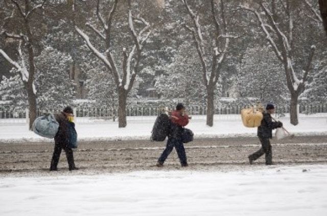 Заради снега движението в китайската столица бе изключително затруднено