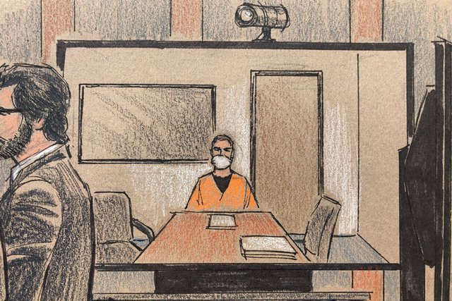 Скица на момент от съдебното заседание. Шовин, в оранжев затворнически костюм и с окови, е участвал по видеовръзка. Снимка: АП/БТА